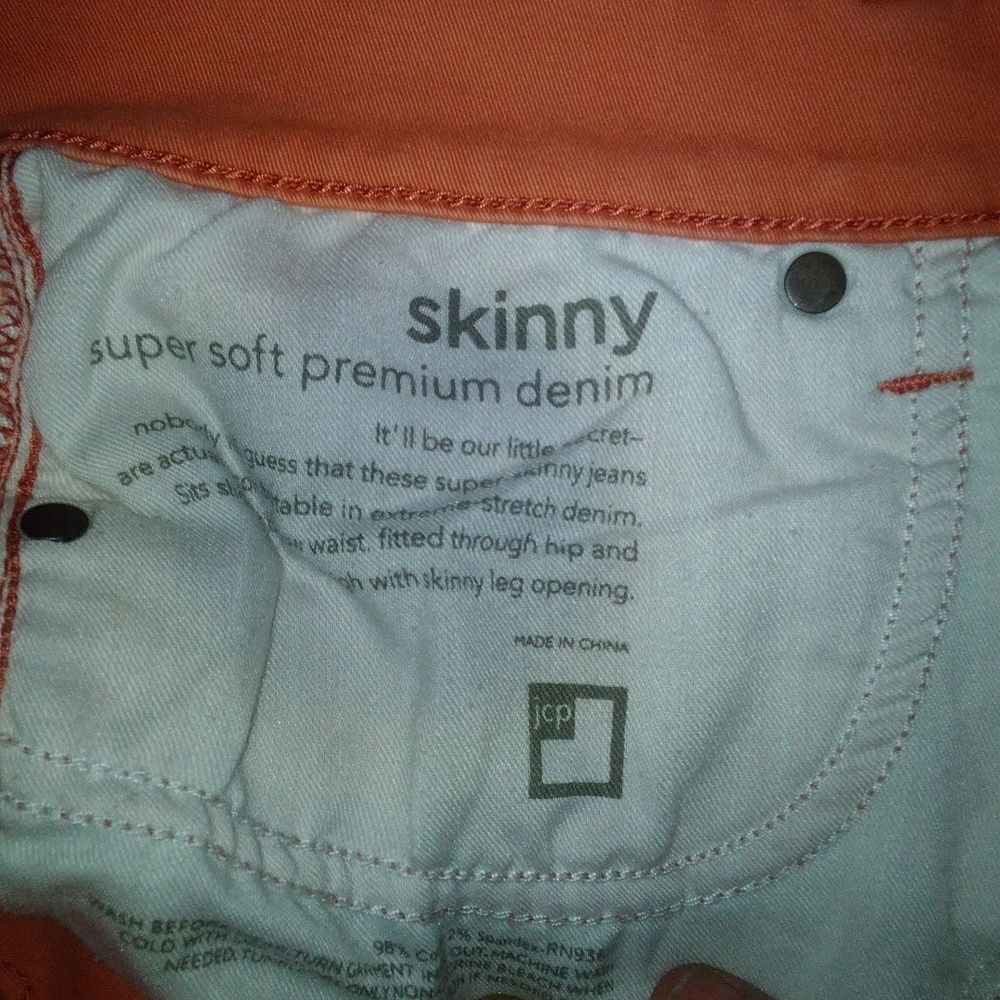 JCPenney orange skinny jeans